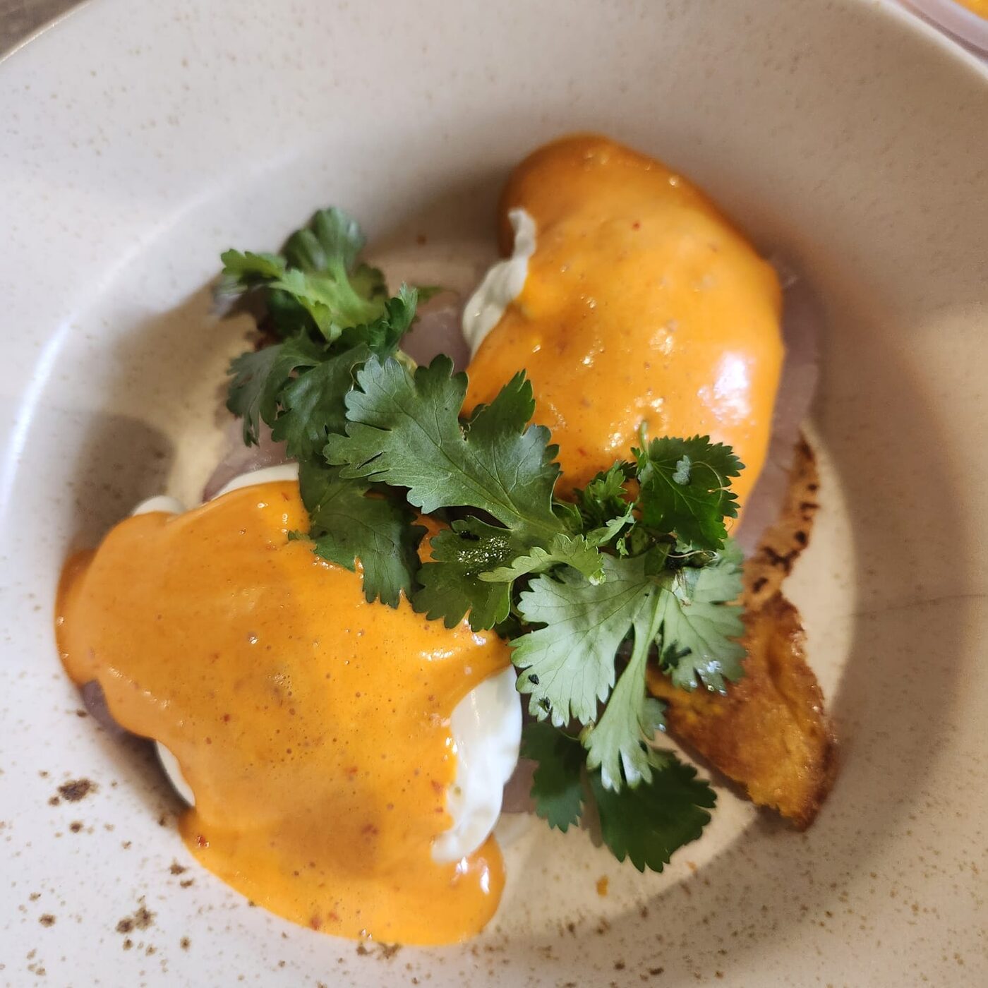 Eggs Benedict with guajillo and mezcal-infused hollandaise