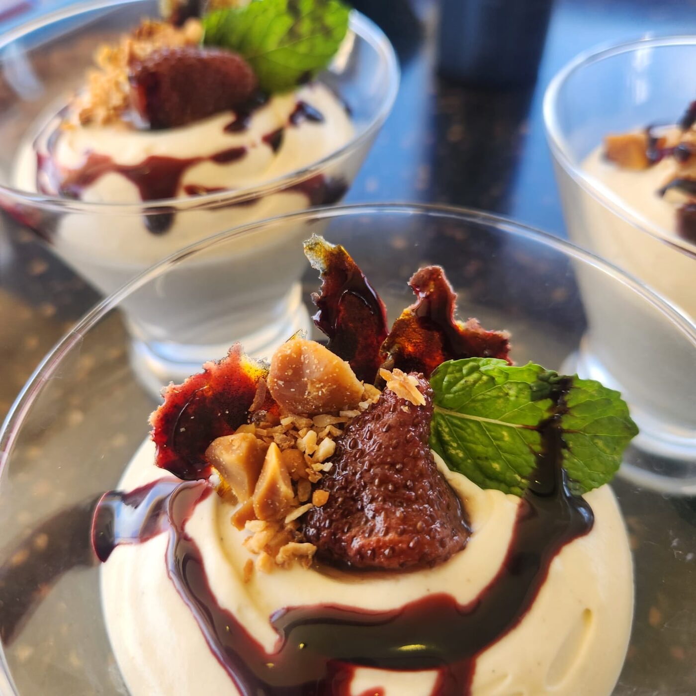 Vanilla mousse with braised strawberries and hibiscus syrup