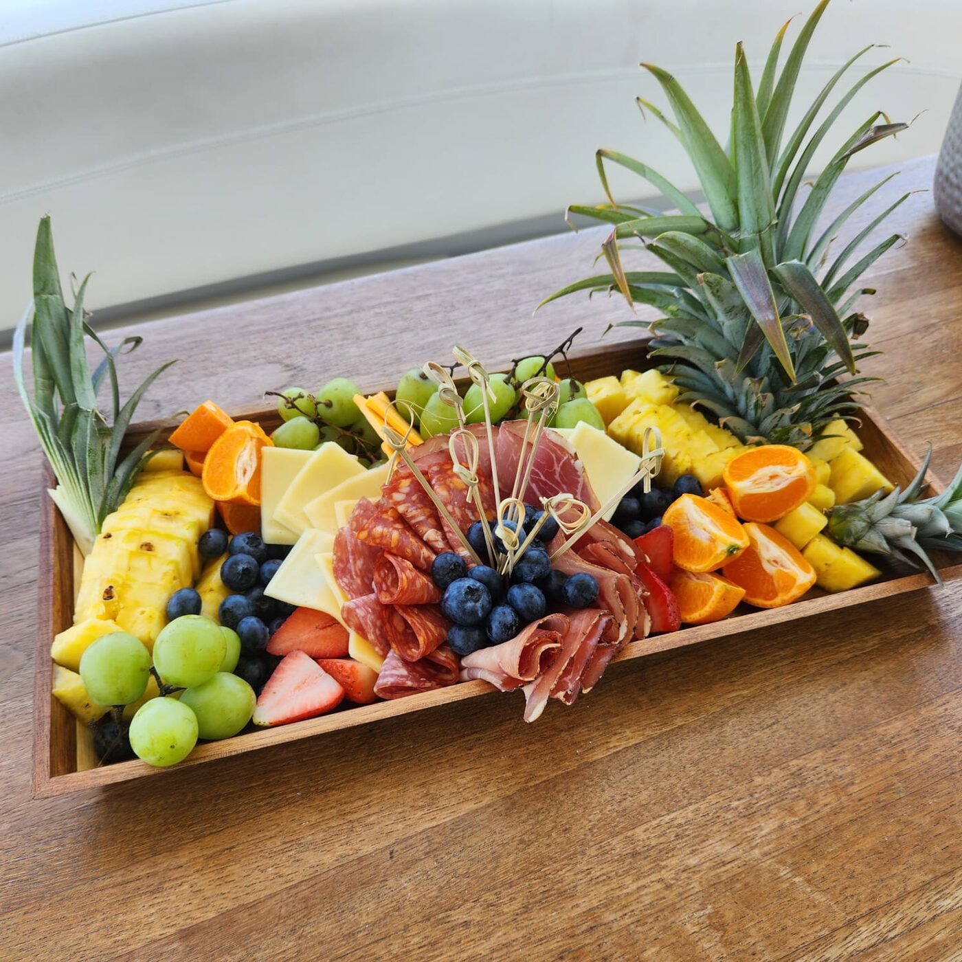 Charcuterie board with cured meats, artisan cheeses, and seasonal fruit